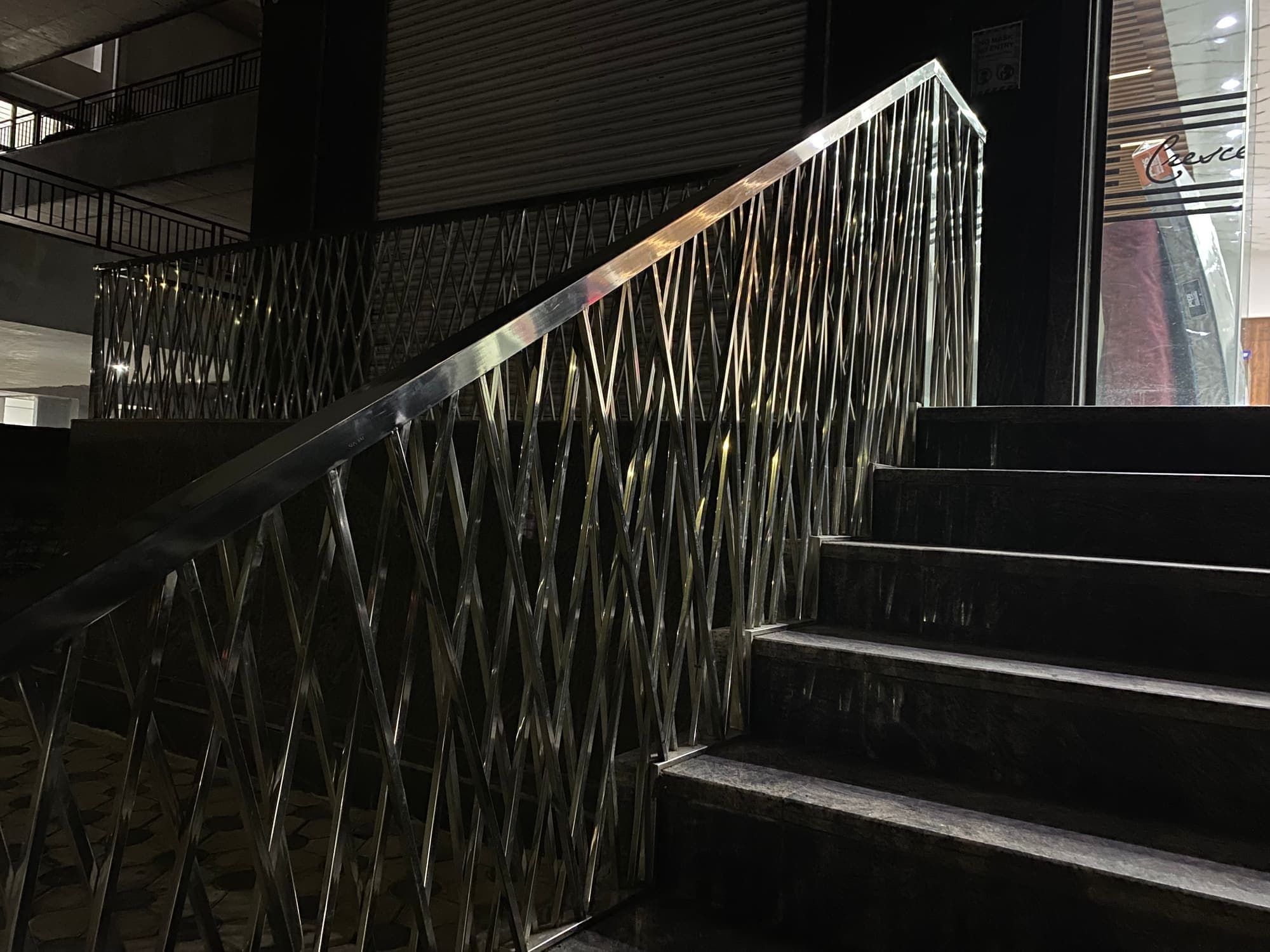 Steel stair railing with a woven pattern