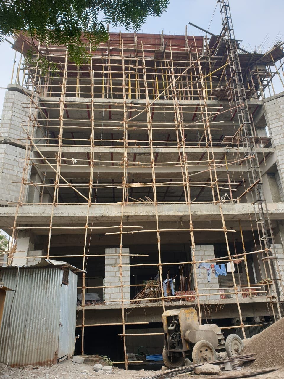 B+G+4 building under construction with scaffolding