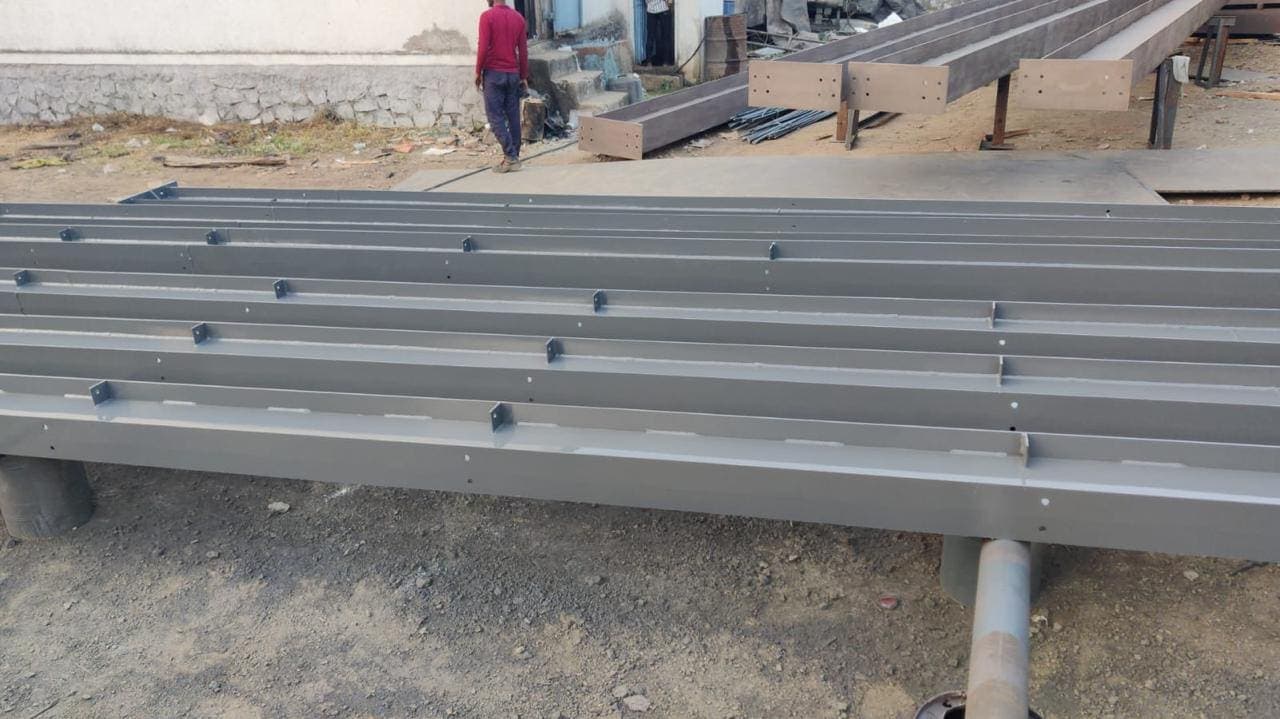 Built-up steel sections laid out ready for erection