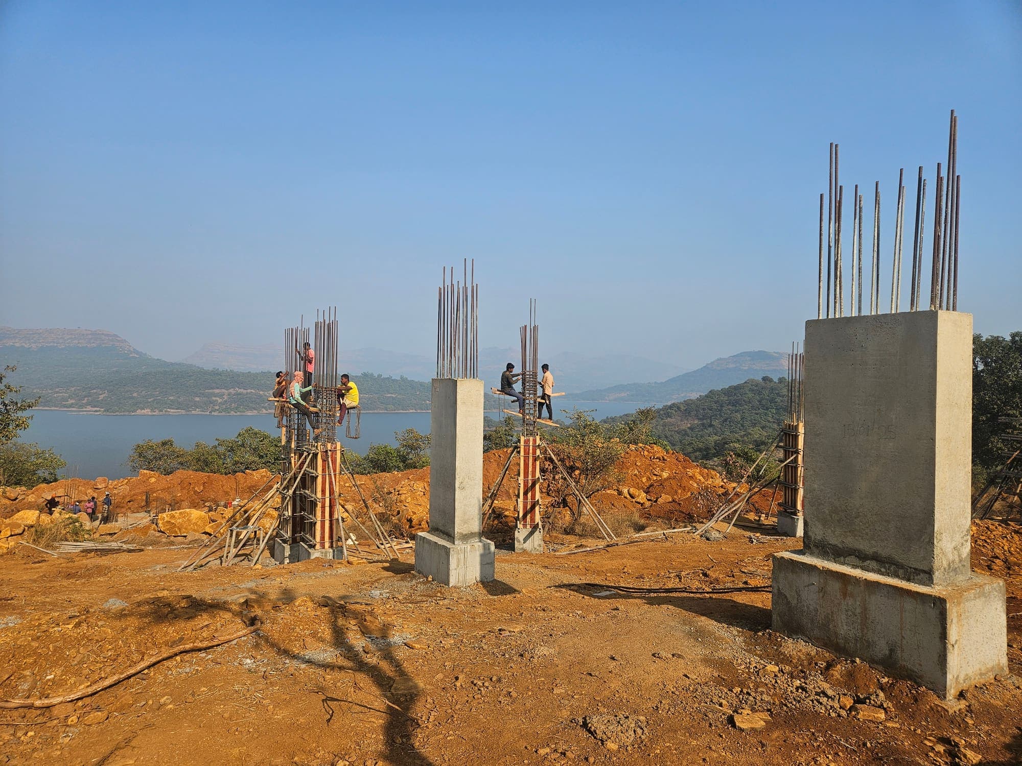 Concrete column starters rising on the resort site
