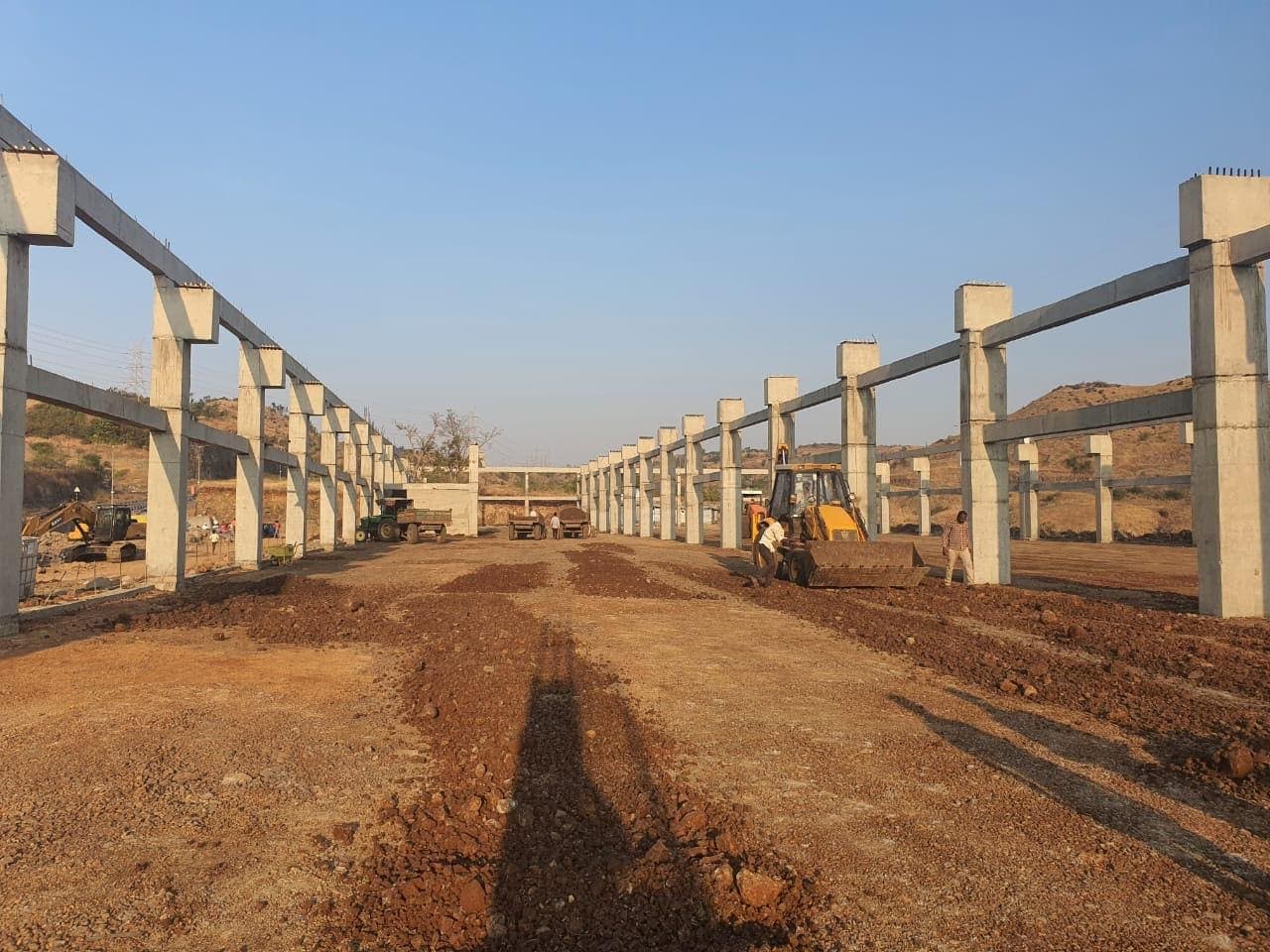 Column and beam frame going up across the four-acre site