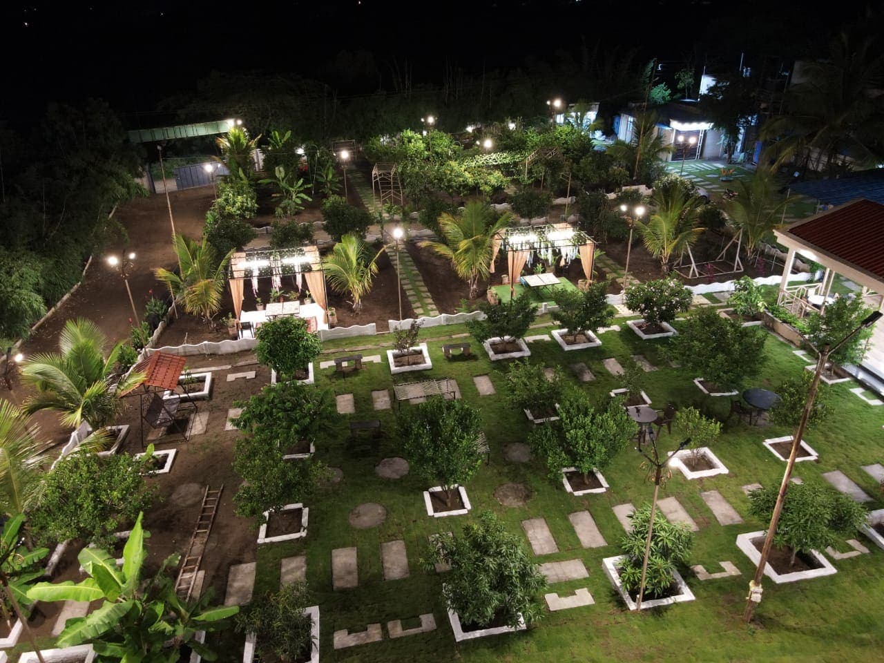 Resort gardens and pathways lit at night