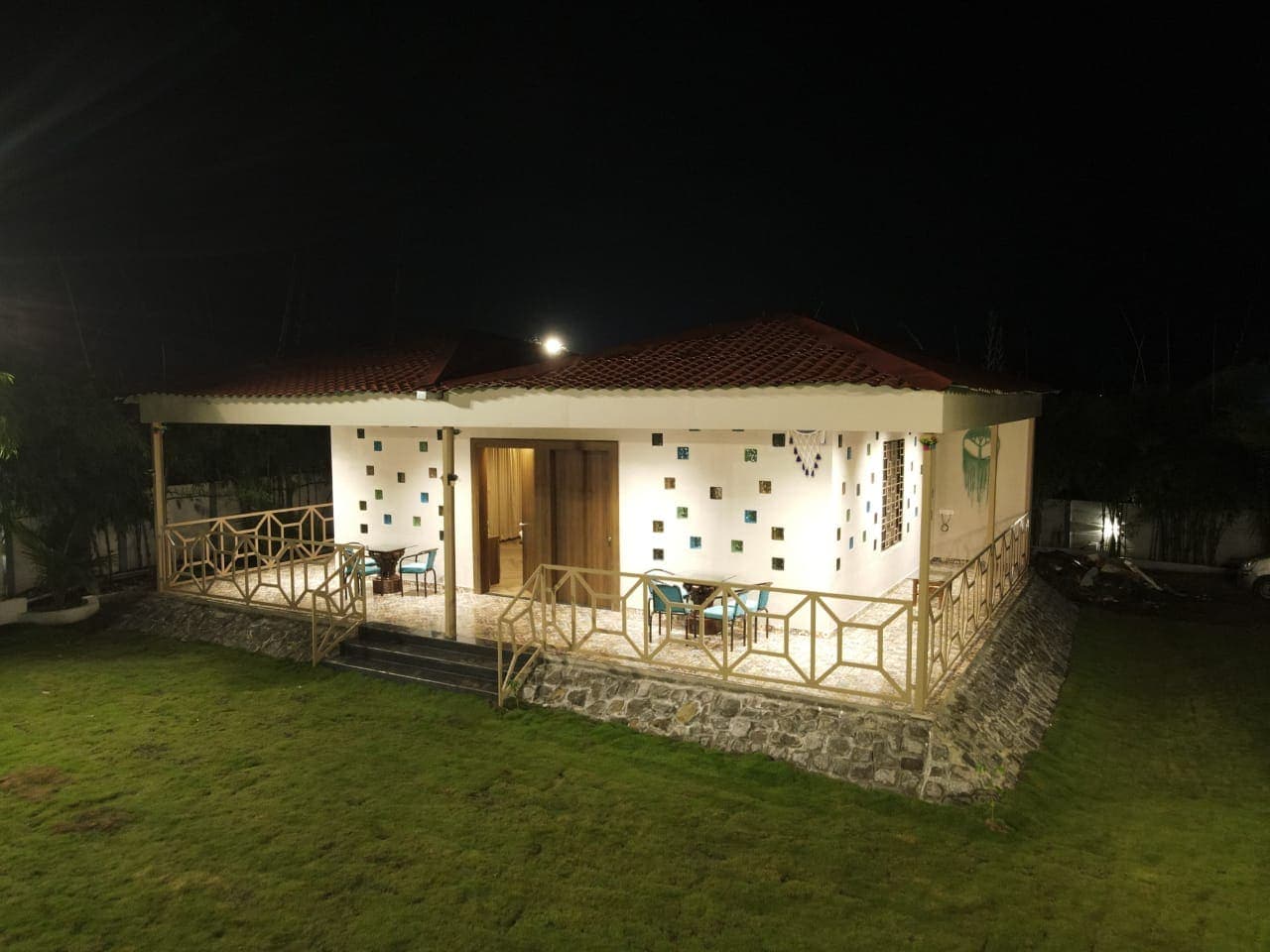 Guest cottage with a veranda at night
