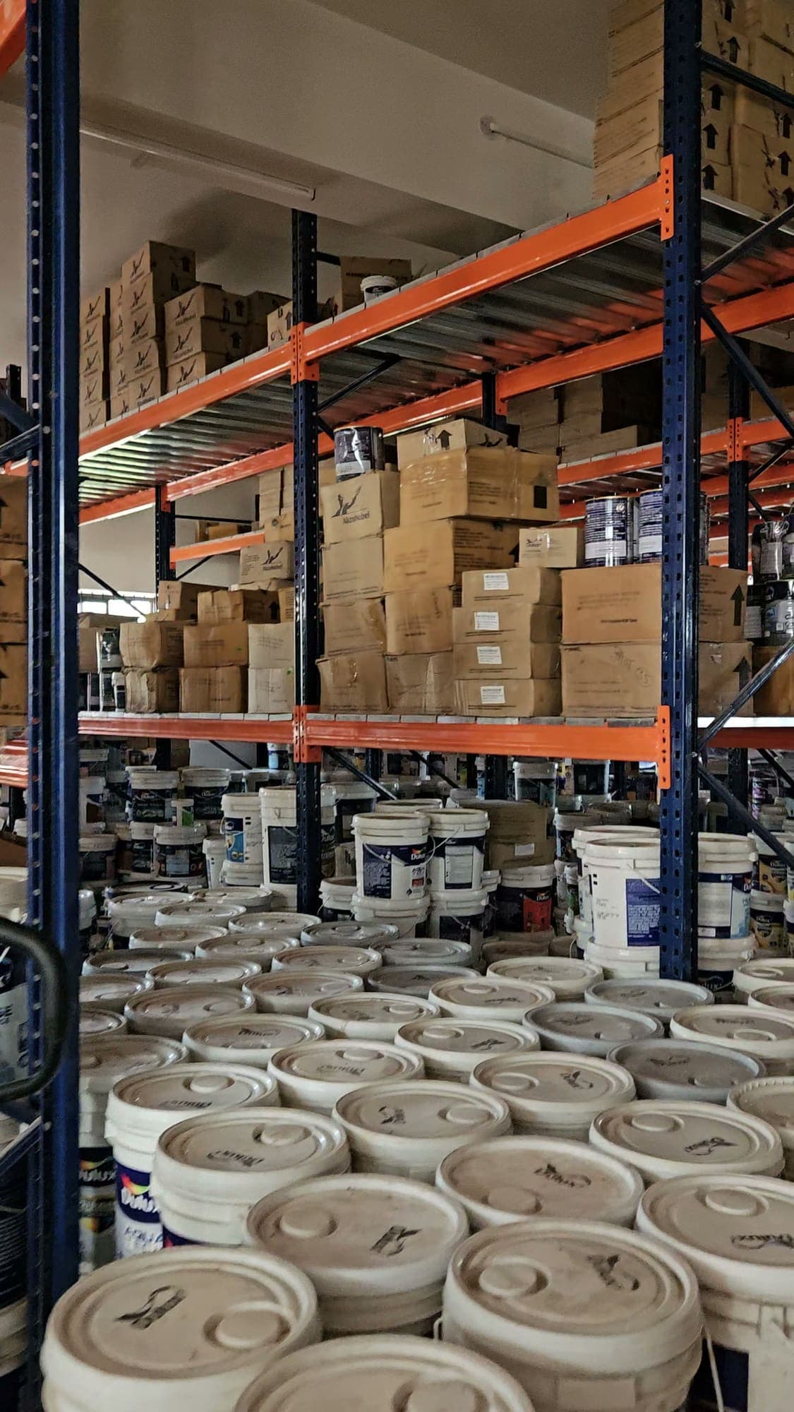 Pallet racking stocked with goods inside the stockyard