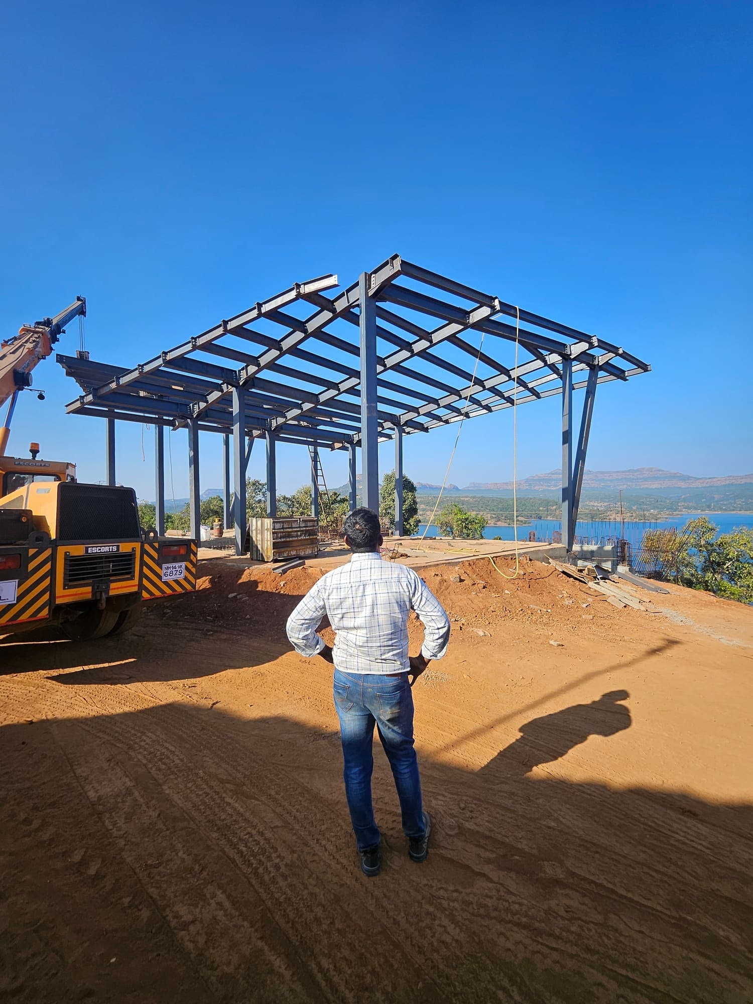 Steel roof frame being erected on the hilltop site